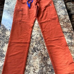 5 FIGS scrub pants size small, 3 FIGS scrub shirts size XS.